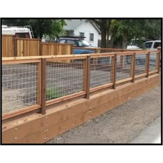 a fenced in area next to a road