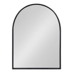 an arched mirror with black frame