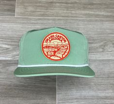 Custom made with a rad park patch & a retro poly rope hat  Taller profile, but fits most heads well up to size 7-5/8 *This is a medium profile (slightly taller) hat that will fit good on medium-large heads *Please feel free to ask questions about the fit; we don't mind at all! *Each listing includes 1 patch, 1 hat & a production fee for us to make the hat for you.   If this hat/patch isn't your style, then check out the 100s of other patches & blanks that we have to create your own wearable masterpiece. Simply pick a patch, pair with the perfect hat and we will do the rest! Green Vintage Trucker Hat For Outdoor, Retro Trucker Hat With Curved Brim For Outdoor Activities, Retro Outdoor Hat With Curved Brim, Retro Curved Brim Trucker Hat For Outdoor Activities, Retro Adjustable Trucker Hat With Logo Patch, Adjustable Retro Trucker Hat With Logo Patch, Vintage Trucker Hat For Outdoor Activities, Vintage Green Snapback Hat For Outdoor, Vintage Curved Brim Hat For Camping