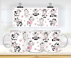 three coffee mugs with cows on them and hearts in the shape of heart shapes