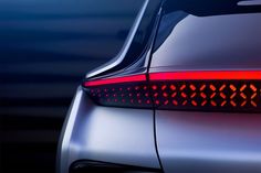 the tail light of a silver car