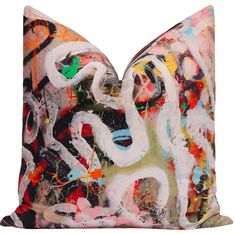 a decorative pillow with an abstract painting on it's front and back sides,