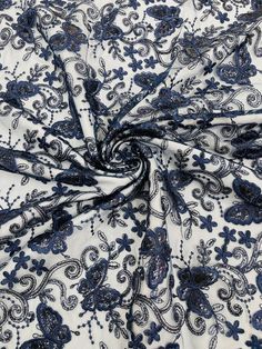 a blue and white fabric with floral design on the bottom, it is very soft