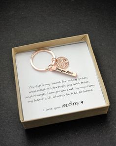 a box with a keychain that says, i love you mom