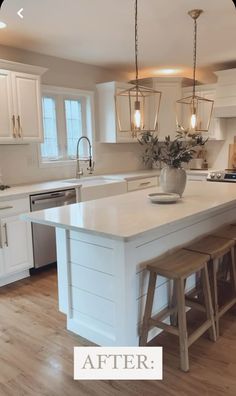 an image of a kitchen with white cabinets and wood stools on the countertop