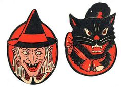 two wooden magnets with faces of witches and cats on them, one has a cat's head in the middle