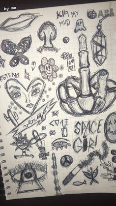 a bunch of doodles that are on top of a piece of paper with writing