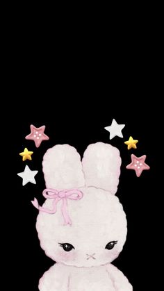 an image of a white bunny with stars around it