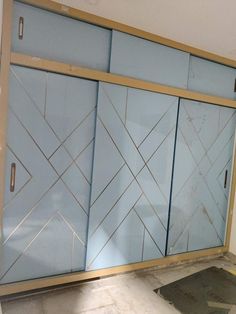 an empty room with some blue glass doors