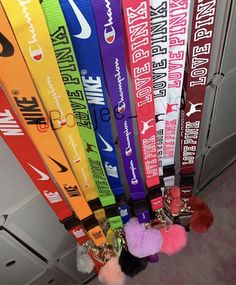 a bunch of colorful lanyards hanging from the ceiling