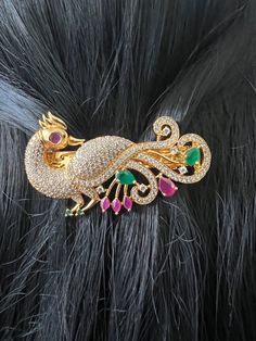 Hair Clip AD Ruby Emerald Stones  Gold Finish / Peacock Designer Hair Clip 2.8 inches Gold Jewelry /Gift Jewelry /South Indian Jewelry This cute hair accessory can be worn for any occasion.  Spring-loaded hair clip. Light-weight. Size: 2.8 inches  Weight: 0.90 oz (26 g) Material: Artificial gold Finish AD Ruby Emerald  Stones. Finish:  Gold finish. PRODUCT CARE: - Avoid contact with water and chemicals such as perfumes or any sprays to prevent product damage.  - Store wrapped in butter paper, cotton cloth, or the provided box. Butter Paper, Silk Thread Bangles Design, Thread Bangles Design, Peacock Jewelry, Hair Brooch, Gold Jewelry Gift, Handmade Hair Clip, Silk Thread Bangles, Thread Bangles