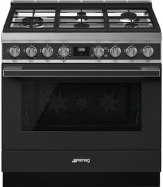 an oven with four burners on the front and one in the back, is shown