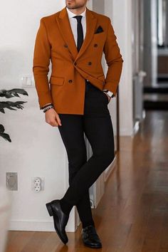 Burnt Orange Mens Wedding Attire, Black And Orange Suit Men, Burnt Orange Men Outfit, Burnt Orange Trousers Outfit, Orange Notch Lapel Blazer For Work, Brown Notch Lapel Blazer For Office, Brown Double-breasted Blazer For Semi-formal Occasions, Tailored Orange Blazer With Notch Lapel, Brown Long Sleeve Office Suits