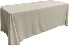 a white table cloth on top of a wooden table