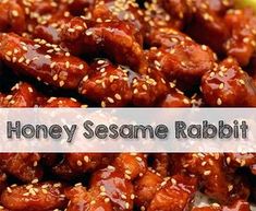 a pile of honey sesame chicken with sesame seeds on top and the words honey sesame rabbit above it