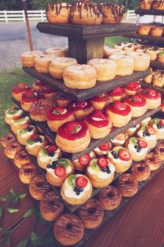 an assortment of pastries are displayed on a table