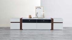 the sideboard is white and brown with two drawers on each side, along with a black drawer