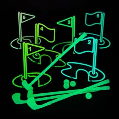 glow in the dark golf game set with tees and ball on black background,