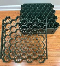 three stacks of green vases sitting on top of a hard wood floor