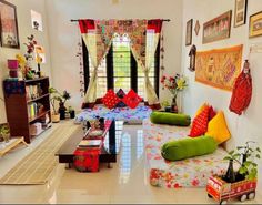 a living room filled with lots of furniture and decor