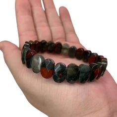 Bloodstone is often referred to as Green Jasper owing to its distinct coloring when seen without spots. Unlike most gemstones, there is a use for bloodstone in our lives. From geopathic stress to everyday despair that follows until the bed, bloodstone can transform life in a wink if you use it correctly. Bracelets Type: Beaded Bracelets Gender: Unisex Main Stone: Bloodstone Style: Casual/Sporty Shape\pattern: Geometric Beads size: about 7x14mm Bracelet length: 19-20 cm Transform Life, African Bloodstone, Green Jasper, Emotional Resilience, Casual Sporty, Emotional Wellness, Shape Pattern, Pattern Geometric, Shape Patterns