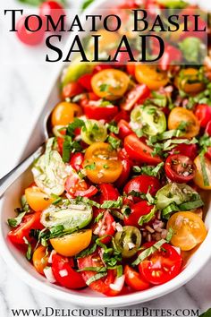 a salad with tomatoes, lettuce and other vegetables is shown in a white bowl