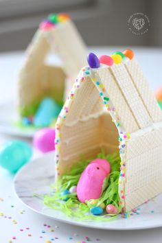 an easter egg house made out of wafer paper and decorated with sprinkles