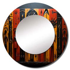 a mirror that is sitting on top of a wooden surface with different colors and shapes