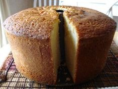 a cake that has been cut in half on a cooling rack