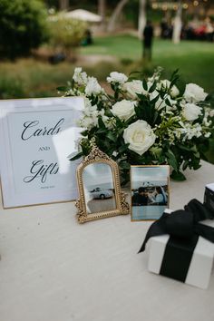 a table with flowers and pictures on it