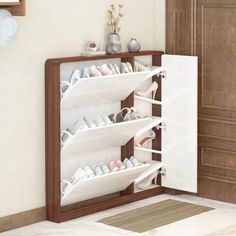 a white shoe rack in the corner of a room