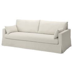 a white couch with two pillows on it