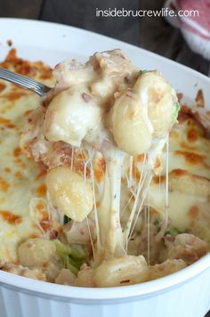 a close up of a plate of food with broccoli and cheese