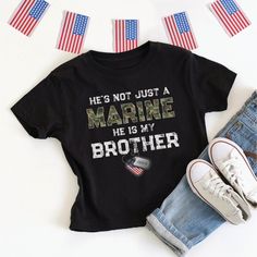 This patriotic He's / She's Not Just A Marine, He / She Is My Brother (Sister, Son, Daughter, Dad, Mom, etc.) kid's t-shirt with personalized Marine name on US flag dog tags is designed for a proud military family member - perfect for boot camp graduation, going away or welcome home party! **Designed by a proud Air Force Mom!** Makes a great gift for special occasions like birthday, holidays, Mother's Day or Father's Day. Easily customize for male or female Marine, dog tag name, and family relationship - and you can choose adult, kids, and baby sizes! Other armed forces branches are available in my Zazzle storefront (click on "FigLilyCo--Military" shop link in the right-hand corner of this page, and again on my shop name there, and head to the "T-Shirts & Clothing" category to see more! Cu Patriotic Father's Day T-shirt With Letter Print, Patriotic Father's Day Letter Print T-shirt, Patriotic Letter Print T-shirt For Father's Day, Marine Sister Shirts, Usmc Graduation, Marine Sister, Marine Dog, Marines Boot Camp, Welcome Home Party