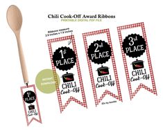 the chili cook off award ribbons are shown with a wooden spoon in front of them