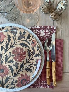 a place setting with silverware and napkins