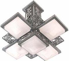 a light fixture with four square shades on the top and two rectangular shades on the bottom