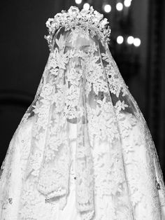 a white wedding veil with flowers on it