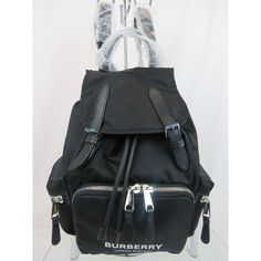 Rucksack Black Eco Nylon Buckle Leather Strap Backpack By Burberry 100% Authentic, Guaranteed!!! A:Ll Md Rucksack N Nb2:117221:A1189 Article 8021261 Color: Black (Print On The Tag) Eco Nylon Upper 2x Silver Tone Metal Engraved "Burberry" Logo Buckled Front Straps Drawstring , Snap Closure And Inner Zip Pocket Padded Back Trim Detail Black Tone Lining 1 Front Zip Around Pocket 2 Exterior Side Zip Pockets Interior: 1 Zippered Logo Pocket Leather Top Handle Adjustable Back Pack Straps Approx. Measu Burberry Rucksack, Burberry Backpack, Plaid Backpack, Plaid And Leather, Flap Backpack, Rucksack Backpack, Leather Rucksack, Leather Buckle, Burberry Bag