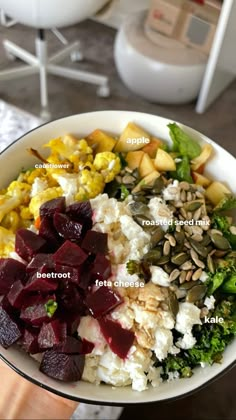 a white bowl filled with different types of food