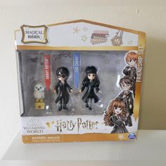 two harry potter action figures in their packaging