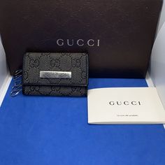 Thank You For Visiting My Closet! Brand: Gucci Materials: Black Canvas With Gucci Monogram Print And Black Leather Lining Hardware: Silver Toned Hardware For The Snap Silver Keychain Hardware Status: Vintage Condition: Preowned. Please See Photos For Condition. Gucci Key Wallet, Key Holder Wallet, Silver Keychain, Gucci Monogram, Monogram Prints, Gucci Accessories, Gucci Black, Key Card Holder, Black Canvas