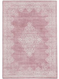 a pink rug with an ornate design on it