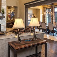 a living room filled with furniture and a fire place