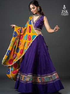 Turn heads this Navratri with our vibrant purple chaniya choli, paired with a stunning yellow dupatta.  #JSKEmporio #FestiveWear #festivecollection2024 #festivecollection #FestiveFashion #LatestCollection2024 #Newcollection #Traditional #navratricollection #navratrichaniyacholi #chaniyacholi #chaniyacholicollection #navratri #Fashion #TrendingDesigns #colourfulchaniyacholi #multicolourchaniyacholi #traditionalchaniyacholi #Vadodara #Baroda #Gujarat #navratricollection2024 #GarbaLook Chaniya Choli Designs Navratri Purple, Latest Chaniya Choli Design, Latest Chaniya Choli Design For Navratri, Traditional Pattern Choli For Navratri Celebrations, Navratri Purple Resham Embroidery Choli, Traditional Navratri Choli With Intricate Embroidery, Designer Navratri Choli With Motifs, Navratri Chaniya Choli Latest 2024, Purple Chaniya Choli