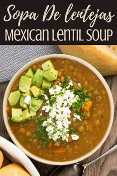 a white bowl filled with mexican lentula soup and topped with sour cream