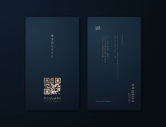 two blue business cards with gold foil on them