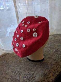 The coziness of felted wool in brilliant red paired with creamy white buttons for a woodland aesthetic. Upcycled felted wool hat with assorted vintage buttons. Woodland Aesthetic, Red Beret, Button Mushroom, Hat Aesthetic, Mushroom Hat, Bonnet Hat, Berets, Cute Hats, Cute Rings