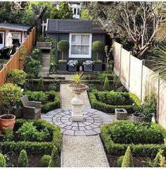 an outdoor garden with lots of trees and bushes