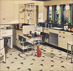 an old fashioned kitchen with white cabinets and black counter tops is featured in the 1950's